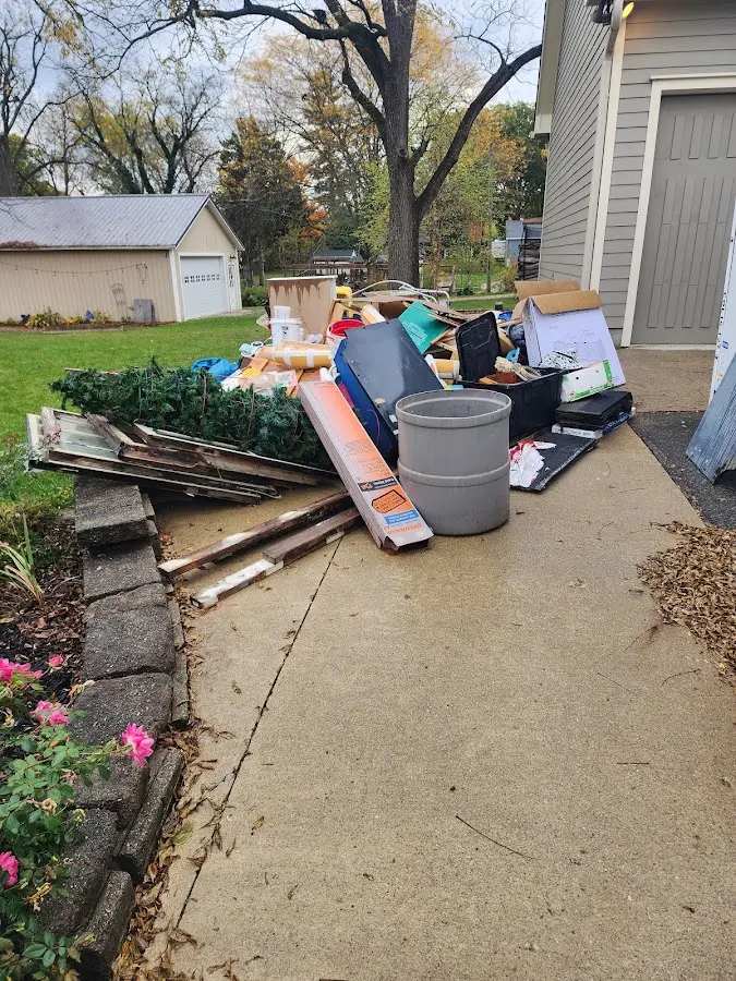 Dumpster being loaded with debris for Roofing Dumpster Rental in Ladson